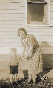 A person with a dog and a cat outside of a building

Description automatically generated with medium confidence